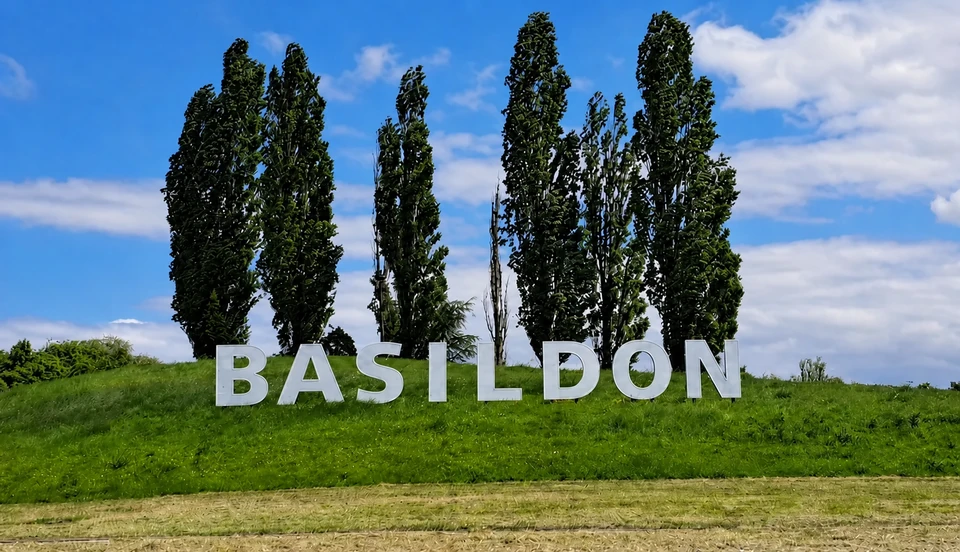 The Basildon sign on its grassy bank